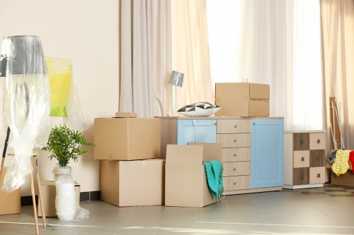 Professional packing team preparing household boxes in Kensington