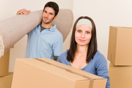 Packed moving boxes and furniture prepared for a Kensington home or office relocation